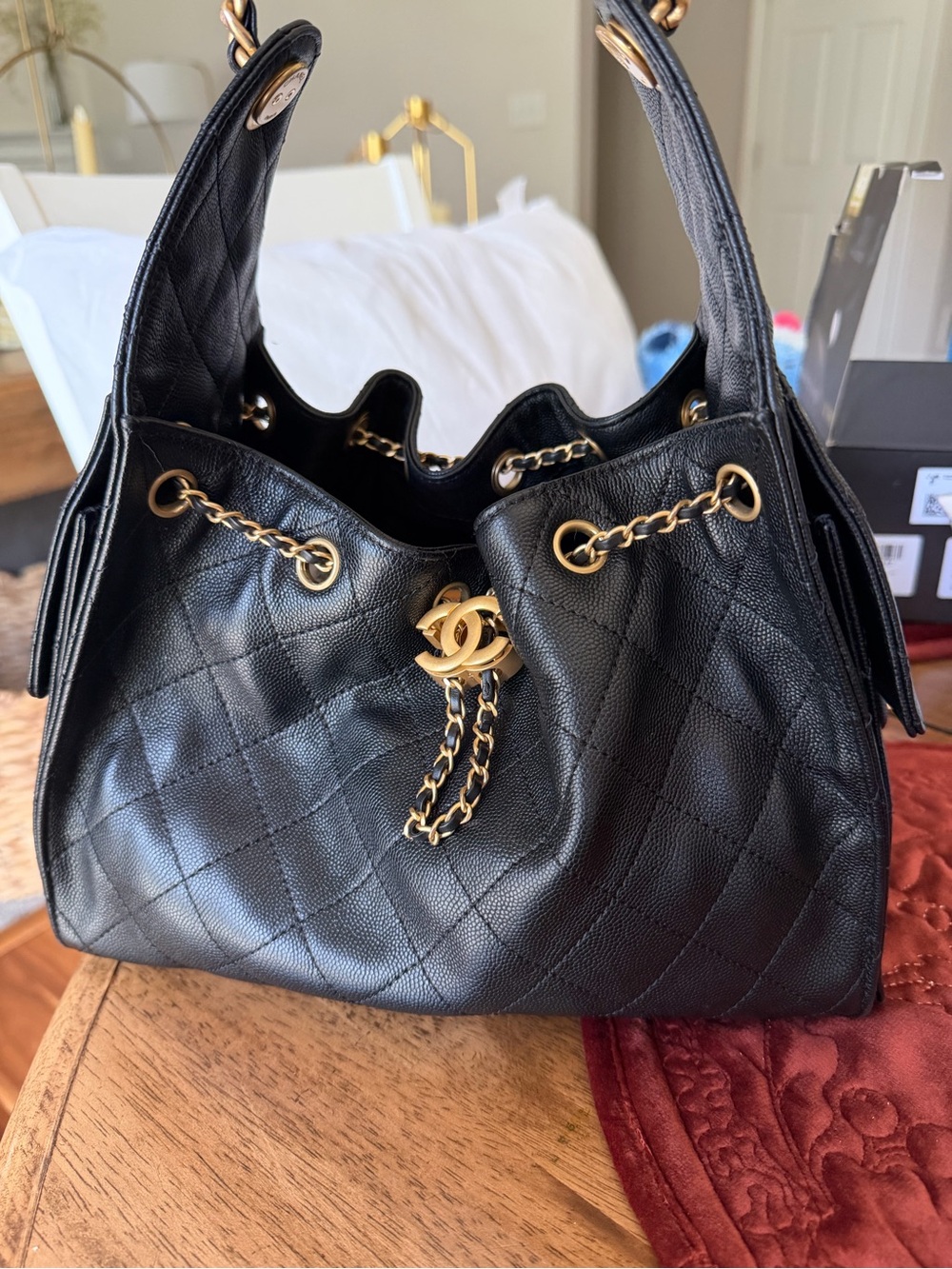 CHANEL 25 Black Quilted Drawstring Shoulder Bag with Gold Hardware